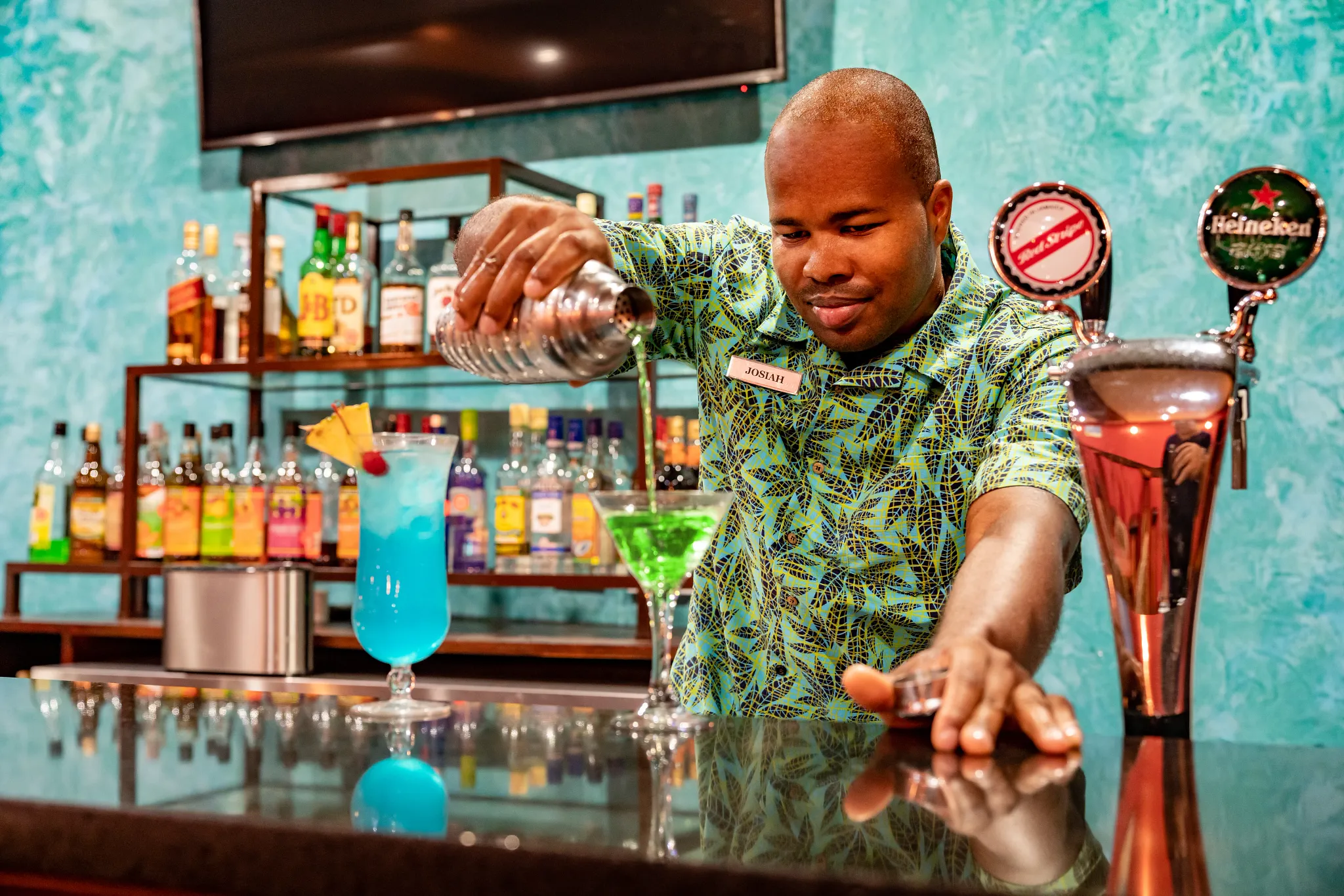 Cricket Club bar at Dreams Rose Hall Resort & Spa featuring classic pub-style décor, premium drinks, and a relaxed lounge atmosphere.