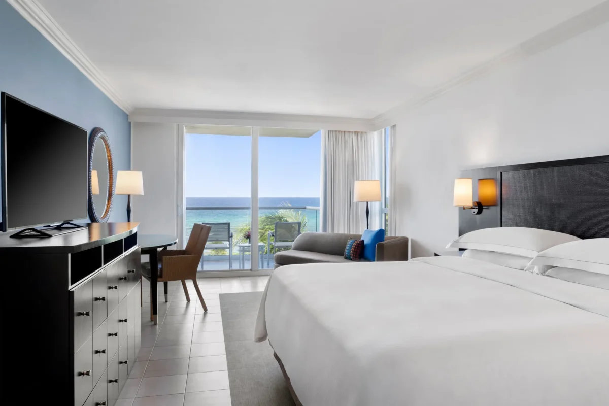 Oceanfront Royal Suite king bedroom with Caribbean Sea views at Dreams Rose Hall Resort & Spa.