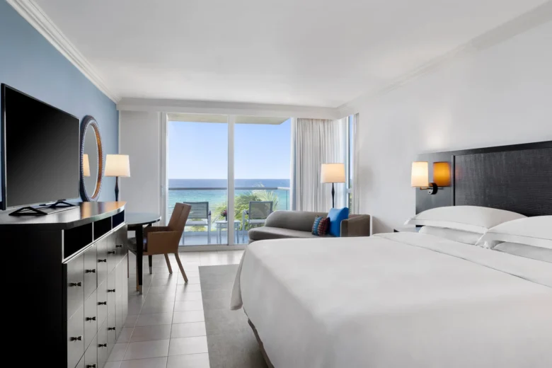 Oceanfront Royal Suite king bedroom with Caribbean Sea views at Dreams Rose Hall Resort & Spa.