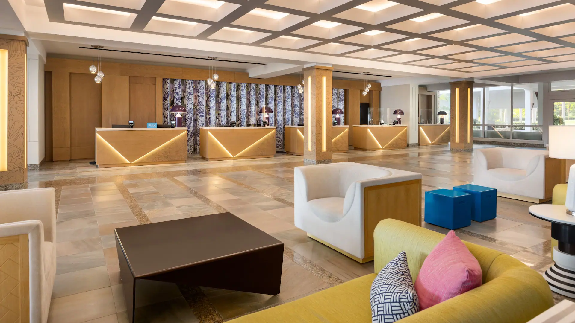Modern resort lobby with elegant seating and check-in area at Dreams Rose Hall Resort & Spa in Montego Bay, Jamaica.
