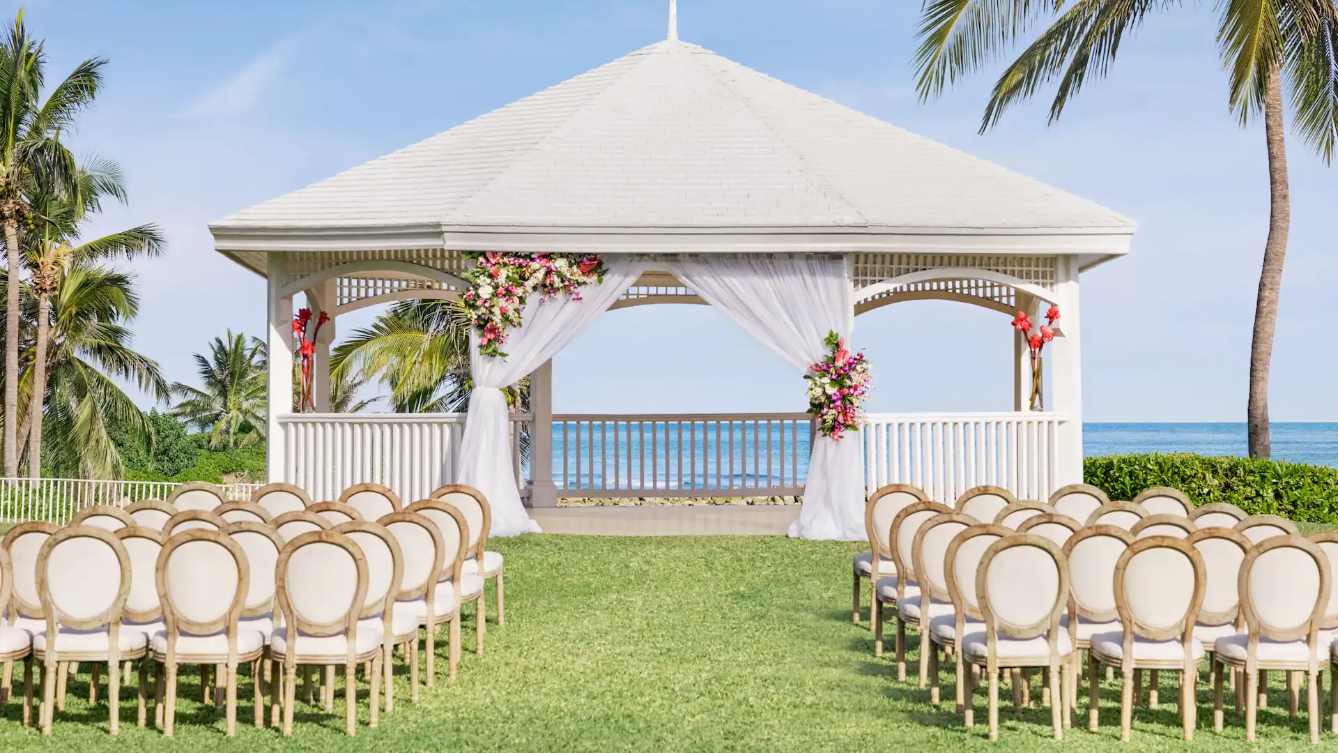 Decorated wedding gazebo overlooking the Caribbean Sea at Dreams Rose Hall Resort & Spa in Montego Bay, Jamaica.